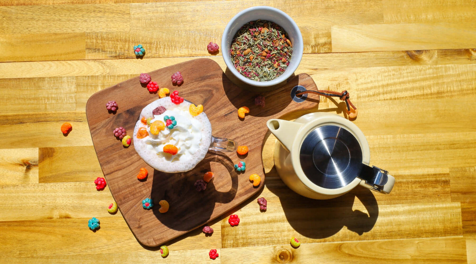 Hot Trix latte with Trix cereal next to bowl of Raspberry Lemon loose-leaf tea and The Nordic Teapot