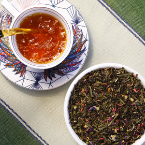 Cup of Blueberry Crumbcake next to bowl of Blueberry Crumbcake loose leaf tea.