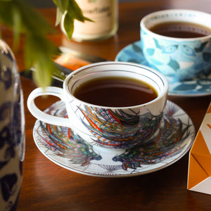 Cup & Saucer filled with brewed Buckingham Palace Earl Grey tea.