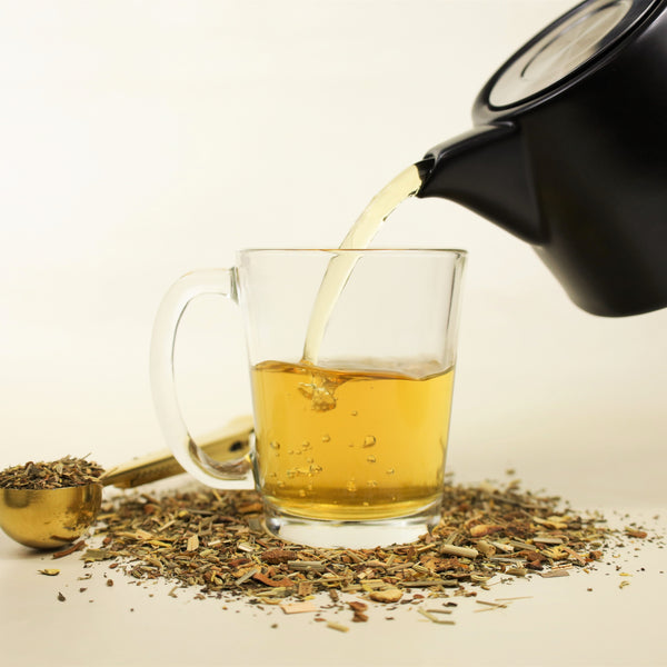 Calming tea poured into glass.