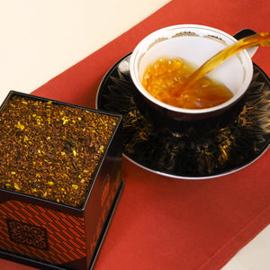 Honeybush Cider in Tea Tin and being poured into Cup & Saucer set