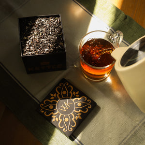 Brewed Lavender Earl Grey being poured into a glass.