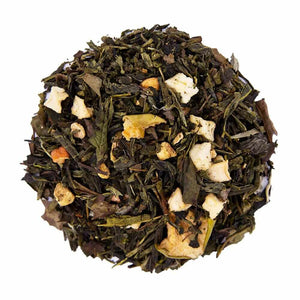 Top mound picture of The Whistling Kettle Apple Ginger green tea with dried apple and ginger bits.