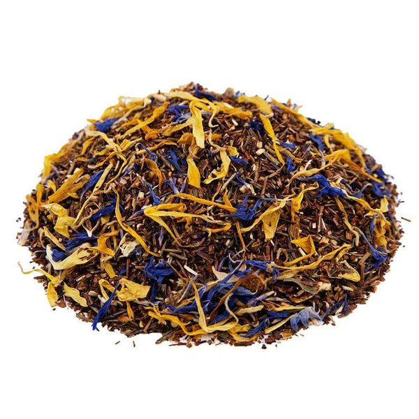 Side mound shot of The Whistling Kettle's Lemon Souffle rooibos and honeybush tea with green rooibos, lemon peel, orange peel, calendula petals, and blue cornflowers.