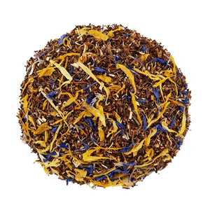 Above mound shot of The Whistling Kettle's Lemon Souffle rooibos tea with honeybush, green rooibos, lemon peel, orange peel, calendula petals, and blue cornflowers.